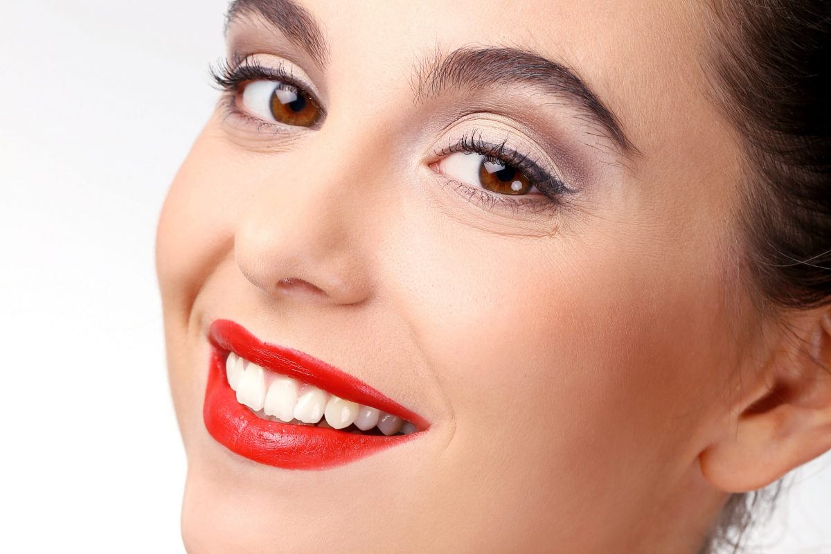 Beautiful girl with perfect skin and red lipstick